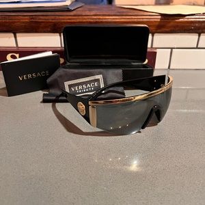 Like new Versace men’s sunglasses.